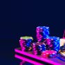 Stacks of Casino Chips and Handcuffs on Laptop Keyboard