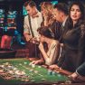 Upper class friends gambling in a casino Upper class friends gambling in a casino